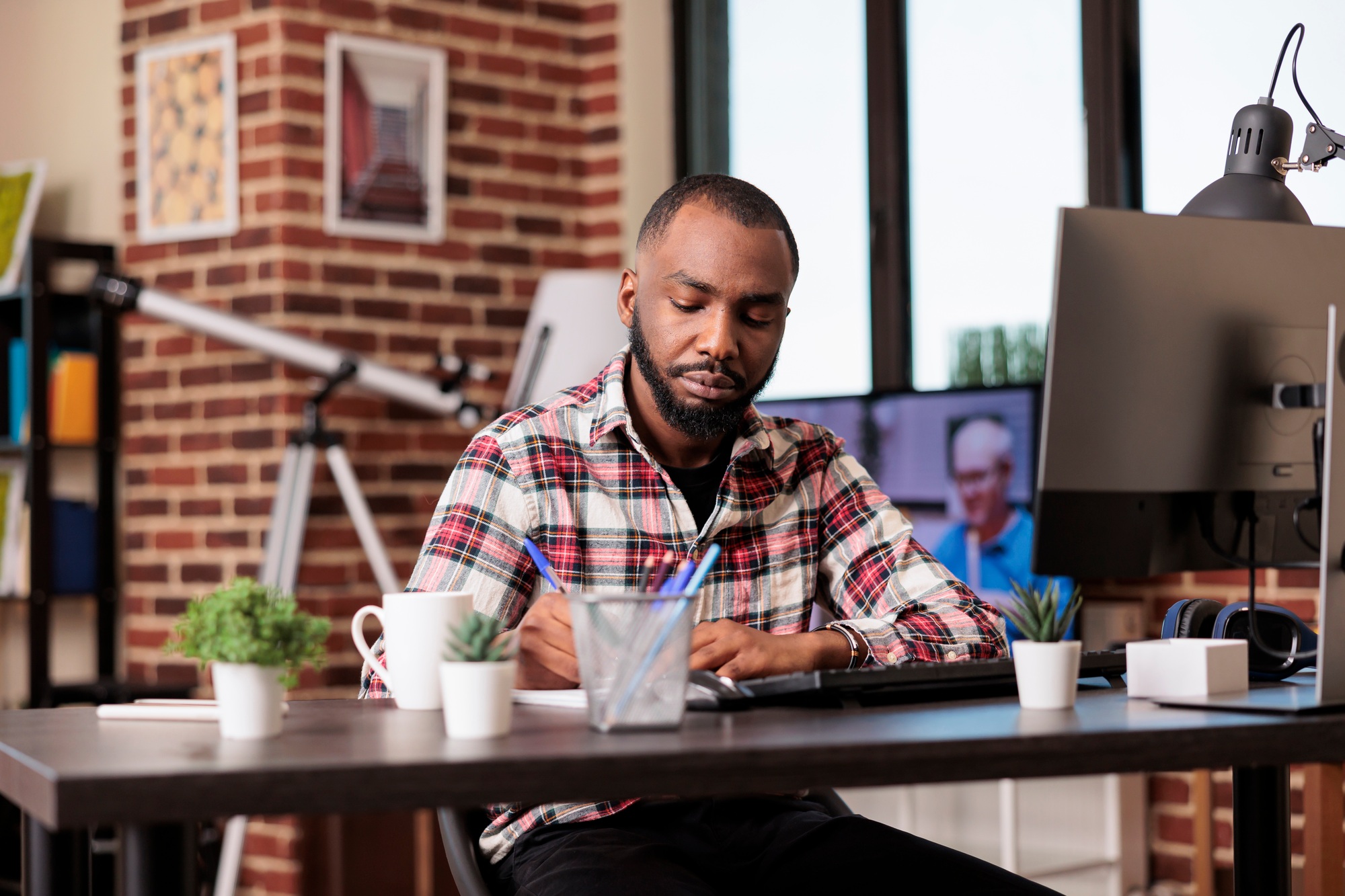 Company freelancer taking notes on files